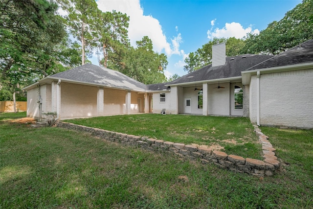 6210 Mahogany Way, Magnolia, TX 77354 - rear view of property featuring ceiling fan, a chimney, brick siding, and a shingled roof