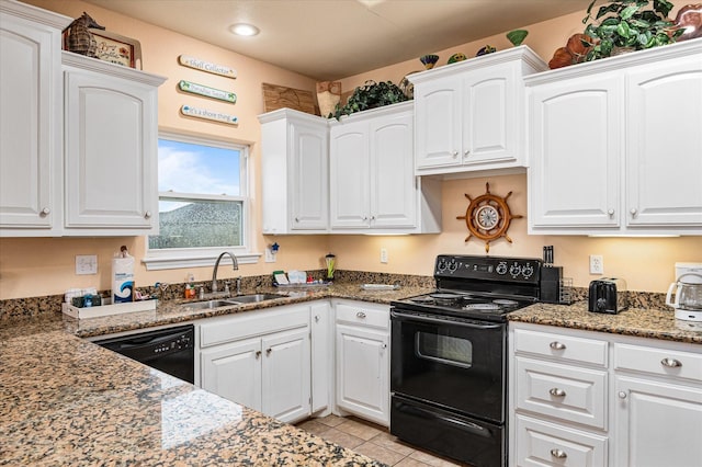 989 Biscayne, Crystal Beach, TX 77650 - kitchen with black appliances, white cabinets, stone countertops, light tile patterned floors, and recessed lighting