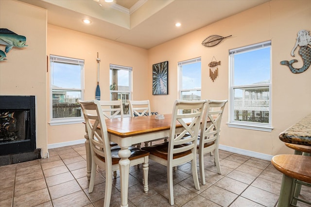 989 Biscayne, Crystal Beach, TX 77650 - dining space featuring ornamental molding, recessed lighting, light tile patterned floors, a raised ceiling, and a fireplace