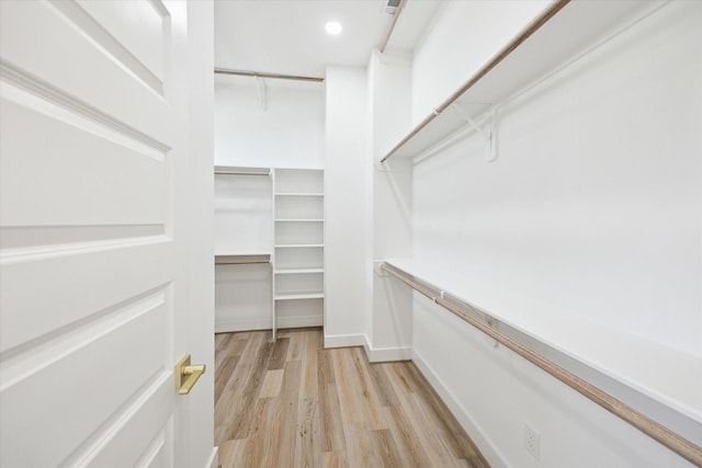 2221 Bevis St, Houston, TX 77008 - spacious closet featuring light wood-style floors