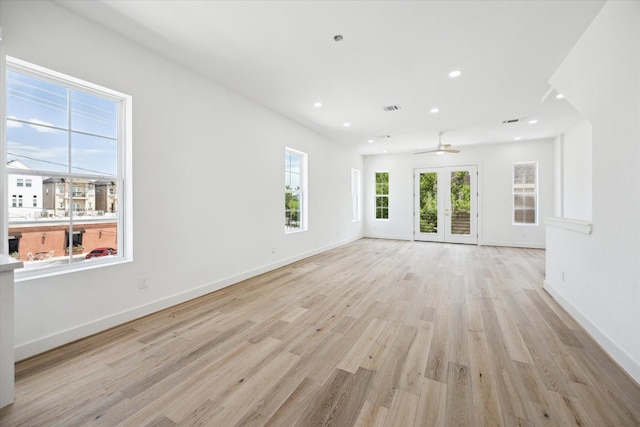 2221 Bevis St, Houston, TX 77008 - unfurnished living room with light wood-style floors, a ceiling fan, recessed lighting, and french doors
