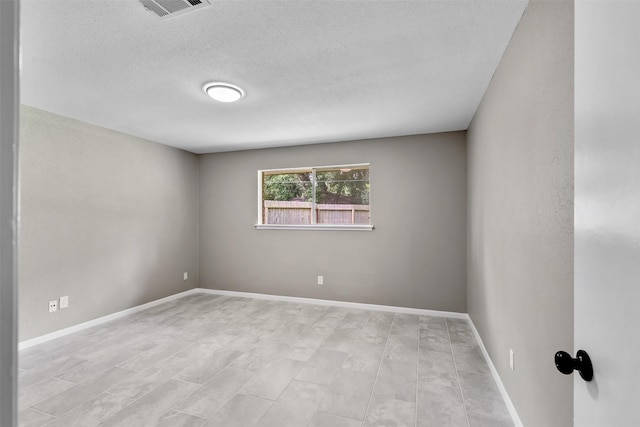21807 Glenbranch Dr, Spring, TX 77388 - empty room with baseboards and a textured ceiling