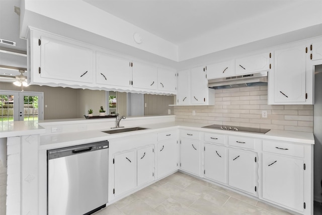 21807 Glenbranch Dr, Spring, TX 77388 - kitchen with stainless steel dishwasher, under cabinet range hood, black electric cooktop, and white cabinetry