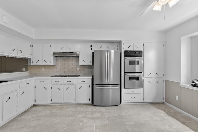 21807 Glenbranch Dr, Spring, TX 77388 - kitchen featuring stainless steel appliances, under cabinet range hood, a ceiling fan, light countertops, and wainscoting