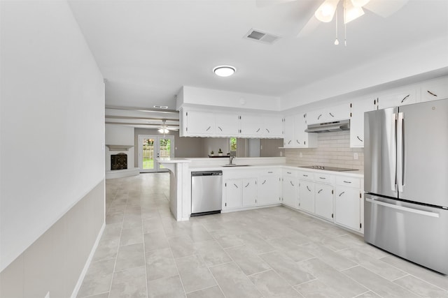 21807 Glenbranch Dr, Spring, TX 77388 - kitchen with appliances with stainless steel finishes, ceiling fan, light countertops, and white cabinetry