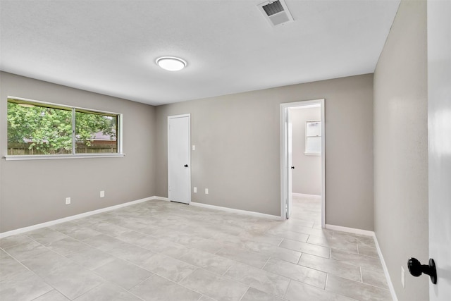 21807 Glenbranch Dr, Spring, TX 77388 - spare room with baseboards and light tile patterned floors