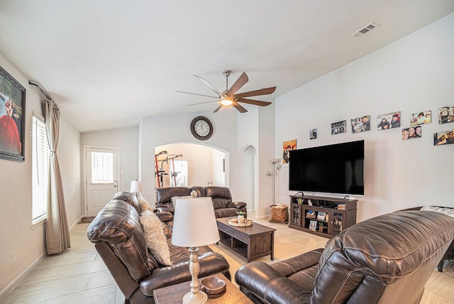 21323 Cypress Live Oak, Cypress, TX 77433 - living room featuring arched walkways, vaulted ceiling, and a ceiling fan