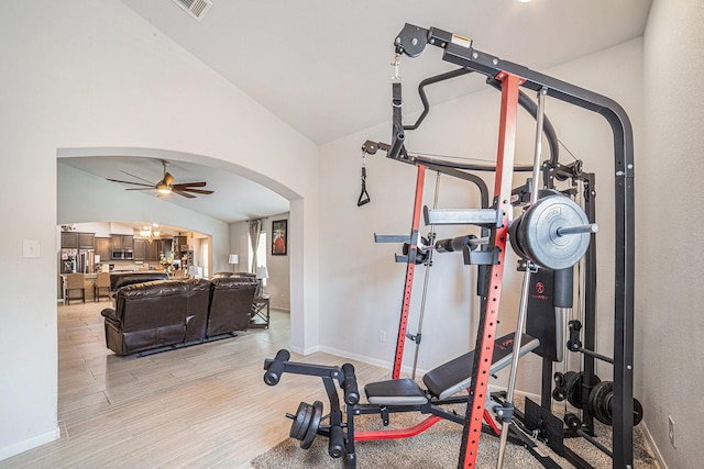 21323 Cypress Live Oak, Cypress, TX 77433 - workout room with arched walkways, vaulted ceiling, a ceiling fan, and light wood finished floors