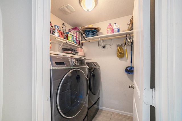 21323 Cypress Live Oak, Cypress, TX 77433 - laundry room with separate washer and dryer and light tile patterned flooring