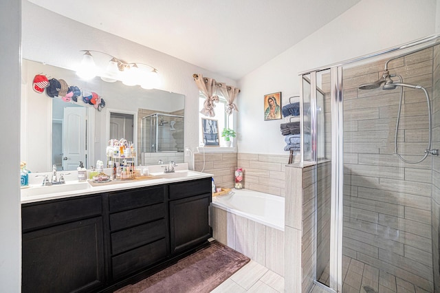 21323 Cypress Live Oak, Cypress, TX 77433 - bathroom featuring a shower stall, a garden tub, double vanity, vaulted ceiling, and tile patterned floors