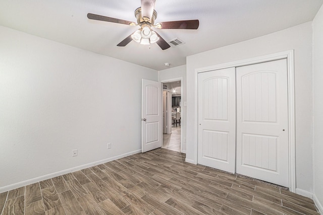 21323 Cypress Live Oak, Cypress, TX 77433 - unfurnished bedroom featuring wood finished floors, a closet, and a ceiling fan