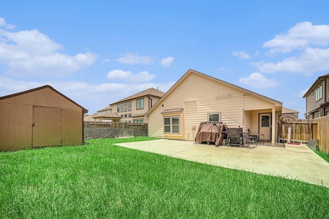 21323 Cypress Live Oak, Cypress, TX 77433 - back of house with a fenced backyard, a patio area, and a storage unit