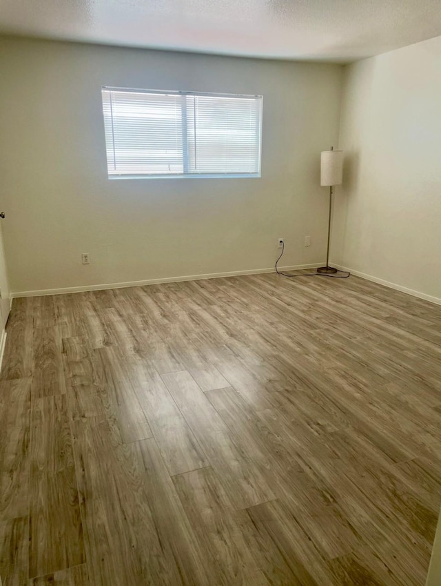 8405 Wilcrest Dr Unit 1606, Houston, TX 77072 - unfurnished room with wood finished floors and plenty of natural light