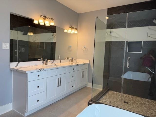 3210 Oakmont St, Houston, TX 77021 - full bath featuring a soaking tub, double vanity, and a stall shower