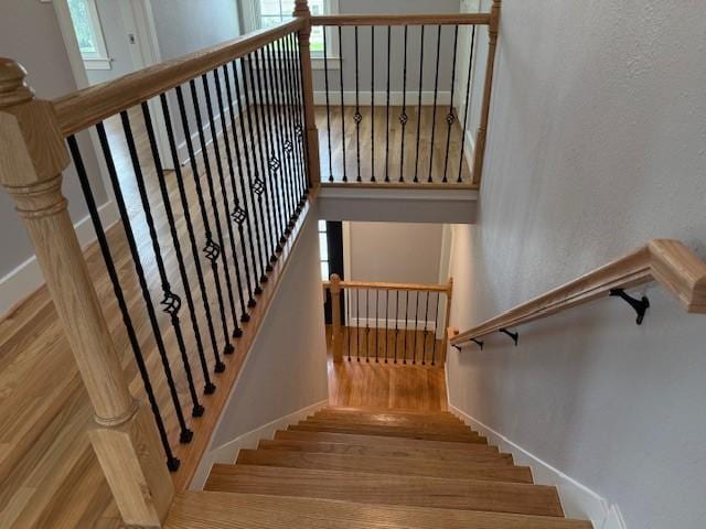 3210 Oakmont St, Houston, TX 77021 - stairway featuring healthy amount of natural light and wood finished floors