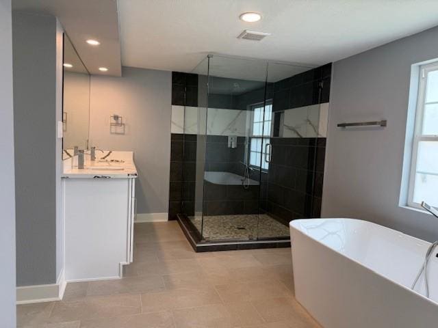 3210 Oakmont St, Houston, TX 77021 - full bathroom with a freestanding tub, vanity, a shower stall, and recessed lighting