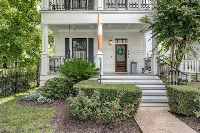 818 Waverly St, Houston, TX 77007 - view of exterior entry featuring a porch and a balcony