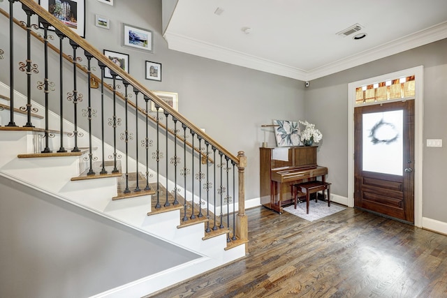 818 Waverly St, Houston, TX 77007 - foyer featuring crown molding, wood finished floors, and stairs