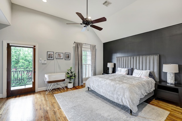 818 Waverly St, Houston, TX 77007 - bedroom featuring high vaulted ceiling, access to outside, wood finished floors, and a ceiling fan