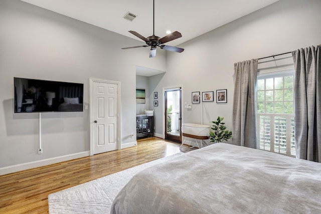 818 Waverly St, Houston, TX 77007 - bedroom with wood finished floors, high vaulted ceiling, and ceiling fan