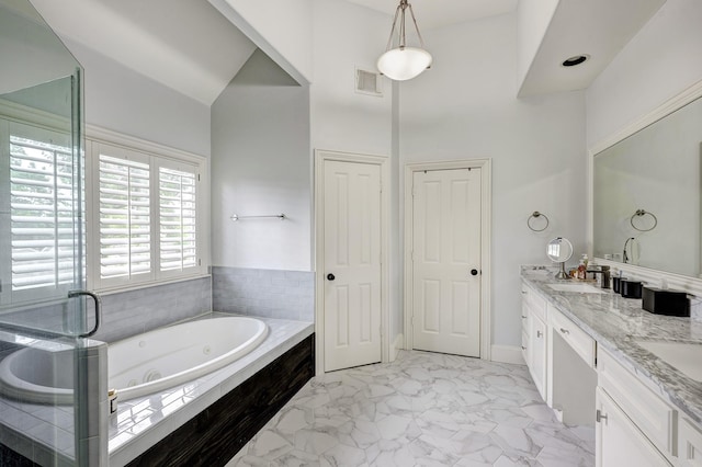 818 Waverly St, Houston, TX 77007 - bathroom with double vanity, a whirlpool tub, marble finish flooring, a high ceiling, and a stall shower