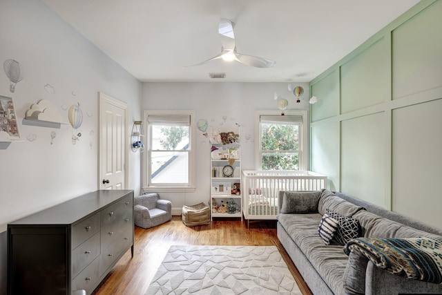 818 Waverly St, Houston, TX 77007 - living room featuring plenty of natural light, ceiling fan, and light wood-type flooring