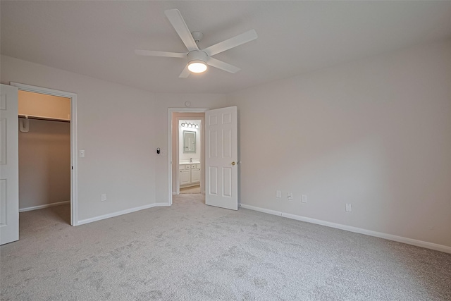 4001 Spring Garden Dr, Pearland, TX 77584 - unfurnished bedroom with a walk in closet, light colored carpet, and ceiling fan