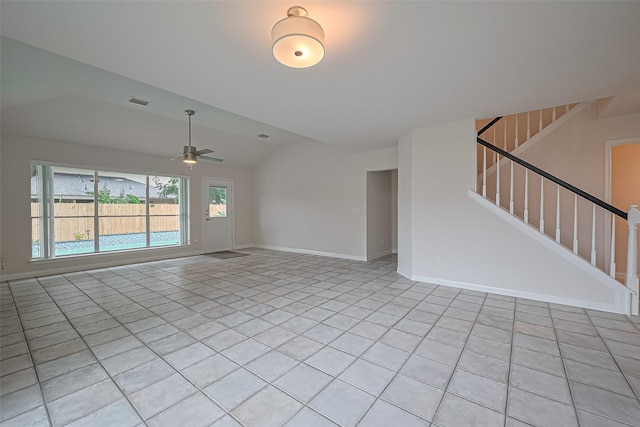 4001 Spring Garden Dr, Pearland, TX 77584 - unfurnished living room with vaulted ceiling, light tile patterned floors, ceiling fan, and stairway