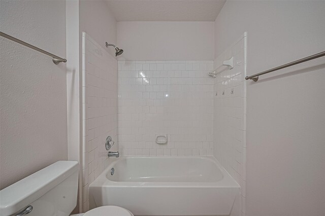 4001 Spring Garden Dr, Pearland, TX 77584 - full bathroom featuring bathtub / shower combination and a textured wall