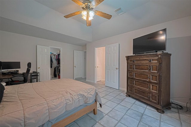 4001 Spring Garden Dr, Pearland, TX 77584 - bedroom featuring light tile patterned floors, a ceiling fan, and a spacious closet