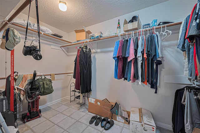 4001 Spring Garden Dr, Pearland, TX 77584 - spacious closet featuring tile patterned floors