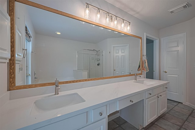 4001 Spring Garden Dr, Pearland, TX 77584 - bathroom with a stall shower, double vanity, tile patterned flooring, and recessed lighting