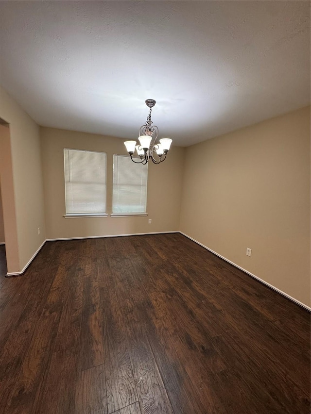 15718 Colonial Bridge Ln, Houston, TX 77073 - unfurnished room featuring a chandelier and dark wood-style flooring