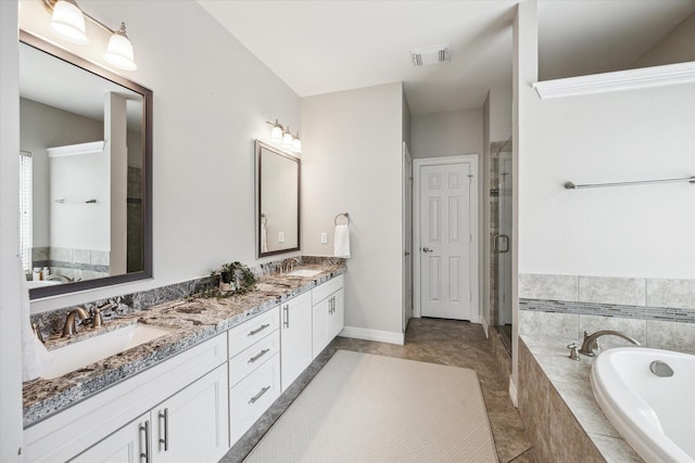 5602 Bergenfield Ct, Katy, TX 77450 - bathroom with double vanity, a garden tub, and a stall shower