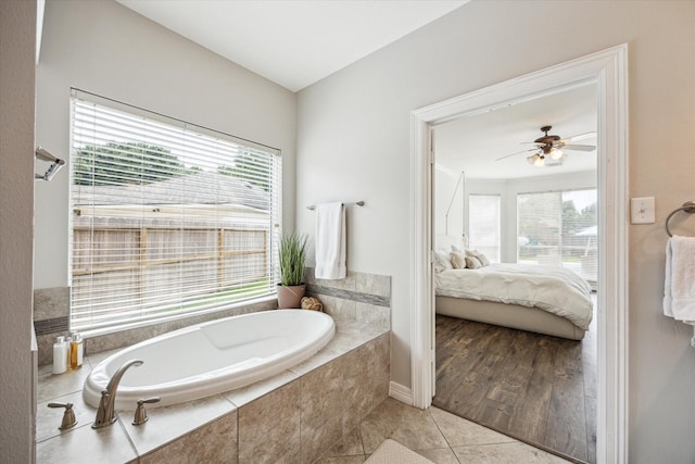5602 Bergenfield Ct, Katy, TX 77450 - ensuite bathroom featuring a bath, healthy amount of natural light, a ceiling fan, and tile patterned flooring