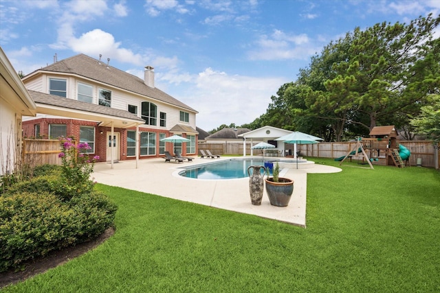 5602 Bergenfield Ct, Katy, TX 77450 - view of swimming pool with a patio area, a fenced backyard, and a playground