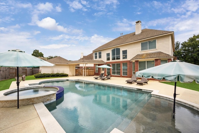 5602 Bergenfield Ct, Katy, TX 77450 - view of swimming pool featuring a patio and a pool with connected hot tub