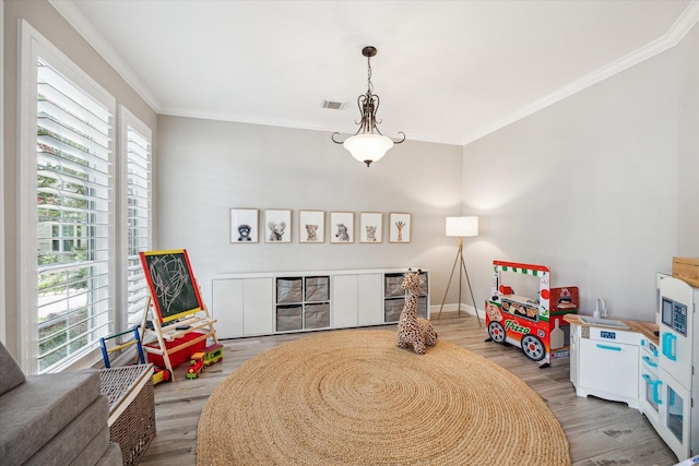 5602 Bergenfield Ct, Katy, TX 77450 - recreation room featuring wood finished floors and ornamental molding