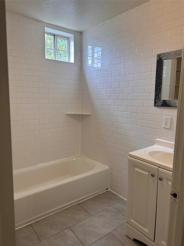 2122 Kowis St, Houston, TX 77093 - full bath with tile patterned flooring, vanity, a textured ceiling, shower / tub combination, and tile walls