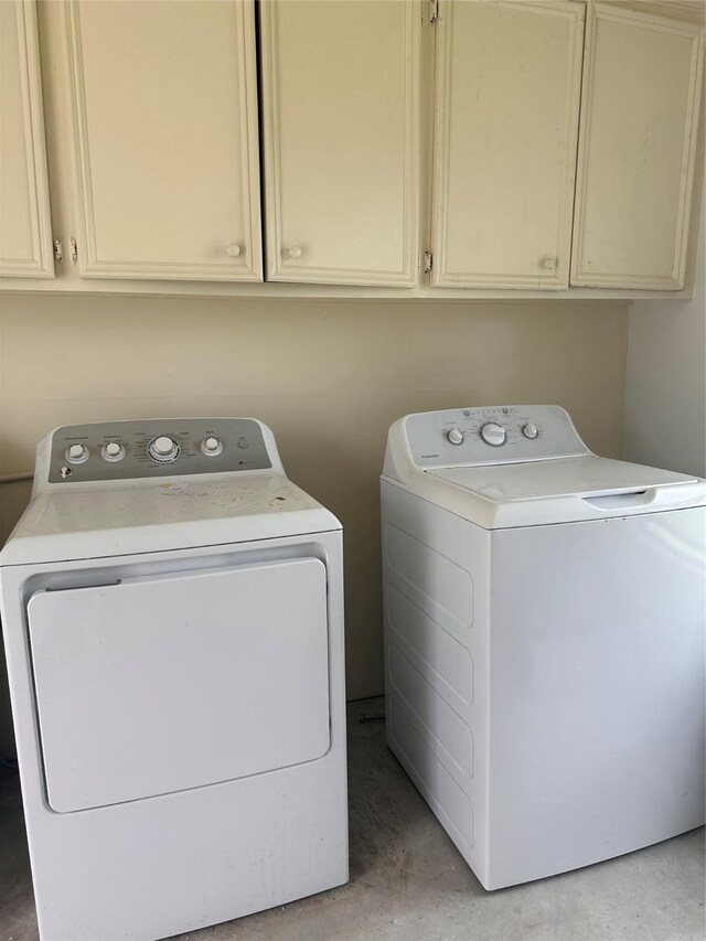 2122 Kowis St, Houston, TX 77093 - washroom with washer and clothes dryer and cabinet space