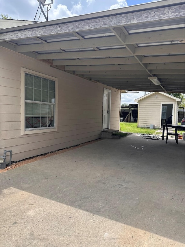 2122 Kowis St, Houston, TX 77093 - view of parking with a carport and a shed