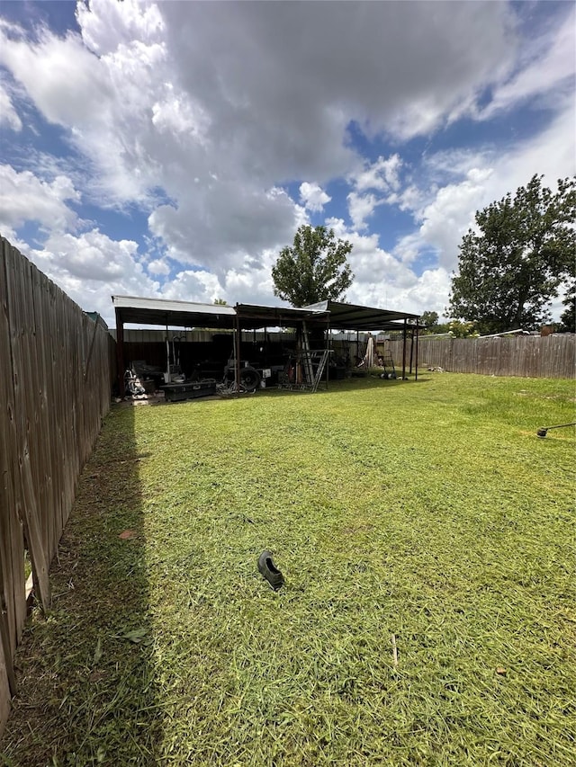2122 Kowis St, Houston, TX 77093 - fenced backyard featuring a carport