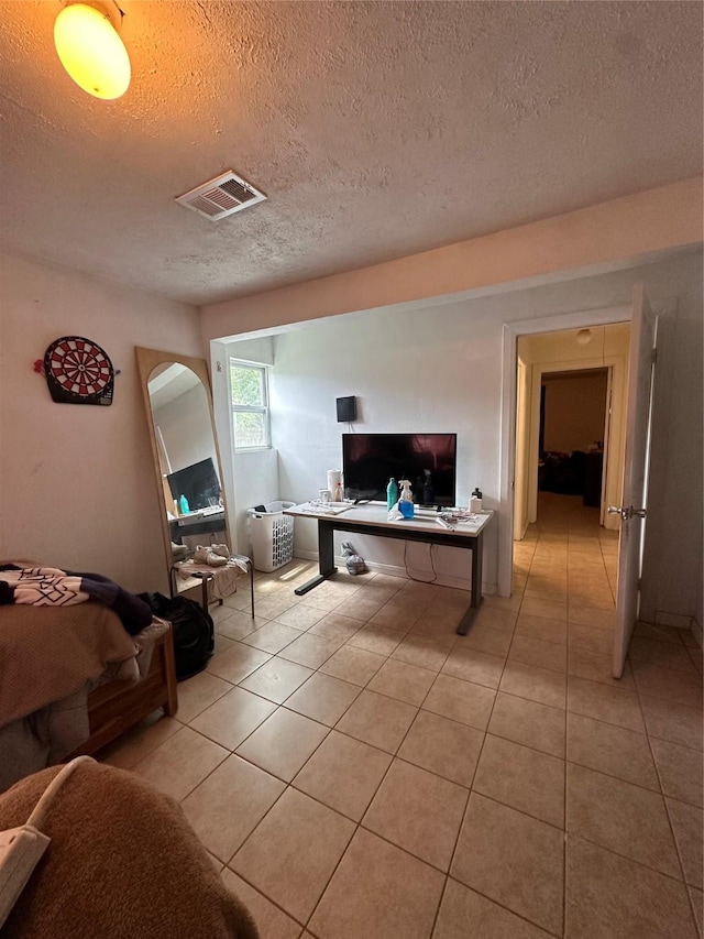 2122 Kowis St, Houston, TX 77093 - home office with light tile patterned floors and a textured ceiling