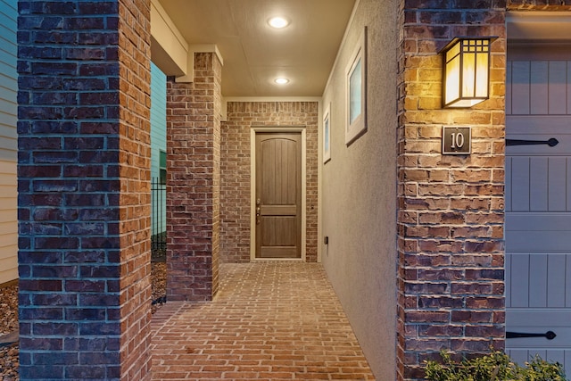 10 Jarvis Row Cir, The Woodlands, TX 77380 - doorway to property featuring brick siding