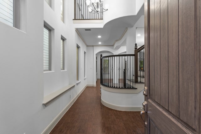 10 Jarvis Row Cir, The Woodlands, TX 77380 - hall featuring a chandelier, wood finished floors, a high ceiling, and stairway