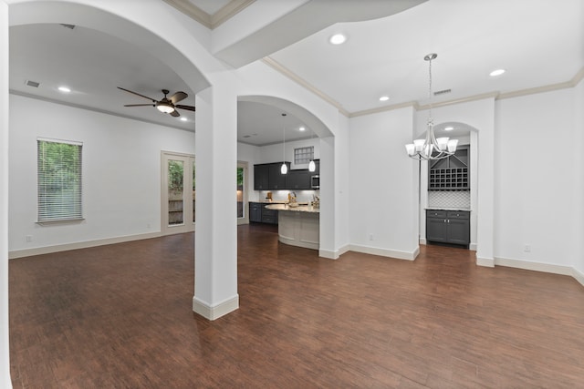 10 Jarvis Row Cir, The Woodlands, TX 77380 - unfurnished living room with recessed lighting, crown molding, ceiling fan, dark wood finished floors, and a chandelier