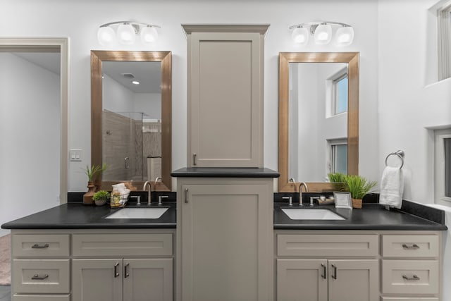 10 Jarvis Row Cir, The Woodlands, TX 77380 - bathroom with a shower stall and two vanities