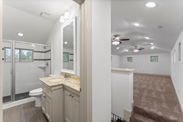 10 Jarvis Row Cir, The Woodlands, TX 77380 - bathroom with lofted ceiling, vanity, a stall shower, recessed lighting, and ceiling fan