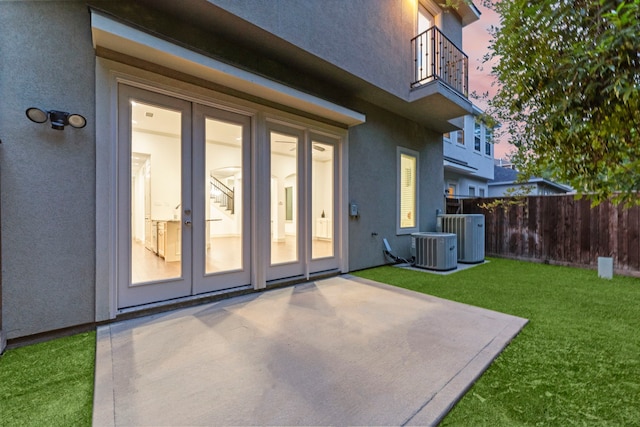 10 Jarvis Row Cir, The Woodlands, TX 77380 - doorway to property with stucco siding, a balcony, a patio, and french doors