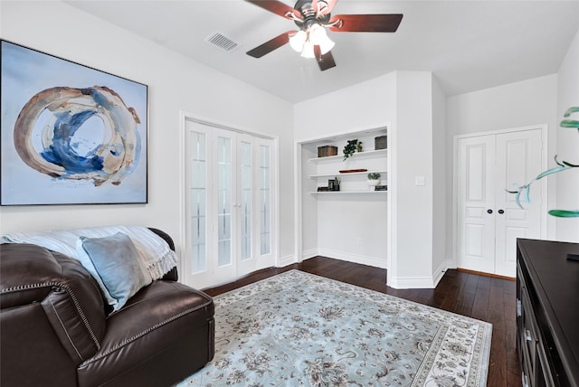 135 Wisteria Walk Cir, The Woodlands, TX 77381 - living area with a ceiling fan, dark wood-style flooring, and built in features